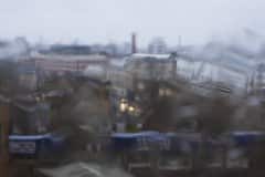 Abstract distortion through glass on a very rainy day, December 2022