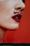 red lips, moustache and chin hair